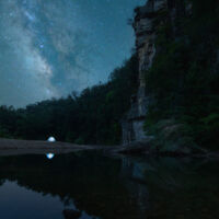Taken June 2022 during a photo workshop course I taught about LLL and stacking. I used a Canon 6D mark ii with a Tamron 15-30 f/2.8 lens; foreground was shot at blue hour at f/11 and was blended with 25 stacked shots of the night sky as well as a lit up tent on the bank.