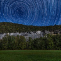 Photo by Brennen Duffield - Taken October 2021 during a photo workshop course I taught about star trails and finding Polaris. I used a Canon 6D mark ii with a Tamron 15-30 f/2.8 lens. We chose a night with a fuller moon to light up the foreground for us. I stacked over 200 images to get the rotation effect while pointing due North.