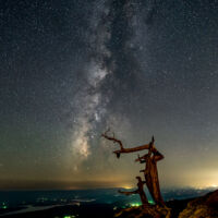Taken September 16th, 2022 at Mount Magazine. Sony A7 iii with a Sony 20mm lens at f/1.8 for 15 seconds at ISO 3200. In this image is the iconic cedar tree of Mount Magazine that succumbed to the elements in 2019 and now there is only a stump left. The Milky Way is in the background and although this is a dark area, light pollution on the right is coming from several cities to the west of Magazine Mountain, Fort Smith being the largest.